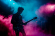 © J S - Korean K-pop band guitar player silhouette performing music on live stage in retro pink and blue light with copy space