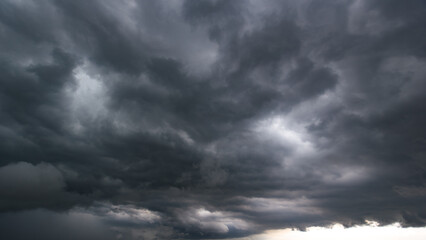 Aufkleber - The dark sky with heavy clouds converging and a violent storm before the rain.Bad or night weather sky and environment. carbon dioxide emissions, greenhouse effect, global warming, climate change