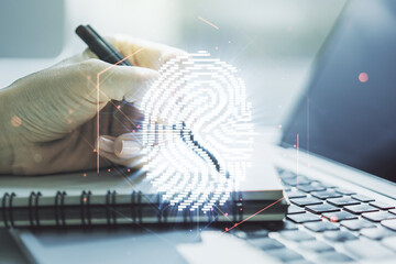 Aufkleber - Double exposure of abstract creative fingerprint hologram with hand writing in notepad on background with laptop, protection of personal information concept