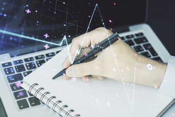 Poster - Creative abstract heart pulse hologram and hand writing in diary on background with laptop, online medical consulting concept. Multiexposure