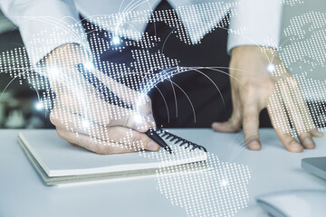 Aufkleber - Double exposure of abstract digital world map with connections and hand writing in notebook on background with laptop, research and strategy concept