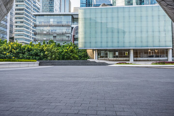 Wall Mural - Empty square floor and city architecture landscape in summer