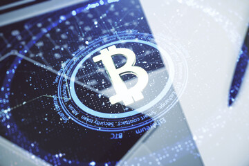 Poster - Double exposure of creative Bitcoin symbol with modern laptop on background. Cryptocurrency concept