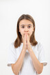 © puhimec - Teenager girl holds her hands in prayer on a white background isolated.