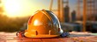construction safety equipment helmet on construction site orange sun background