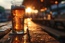 A Glass Of Beer On A Wooden Table