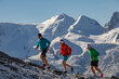 © ADDICTIVE STOCK - Mountain running trio in colorful attire