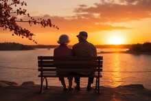 Enduring love a senior couple embraces the beauty of a sunset on a bench
