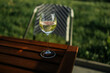 One glass of wine white standing on a table outdoors in the sun light. High quality photo
