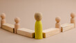 © photo for everything - wooden figure representing a leader leading other figures. Leadership concept