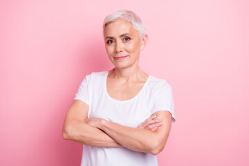 Poster - Photo portrait of attractive pensioner woman folded hands confident expert dressed stylish white clothes isolated on pink color background