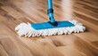 Mopping and foam cleansing on parquet floor, cleaning equipment in use