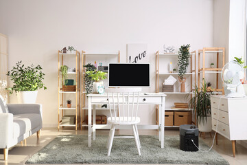 Wall Mural - Comfortable workspace with modern computer and portable power station in contemporary room