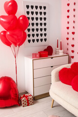 Wall Mural - Cube calendar with date 14 FEBRUARY, candles and gift boxes on commode near pink wall in room decorated for Valentine's Day celebration