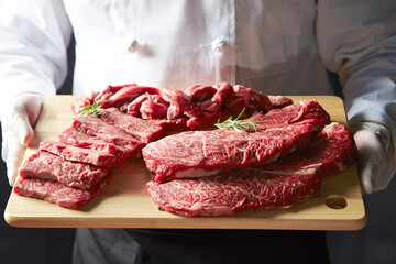 Wall Mural - Several pieces of raw meat on a cutting board