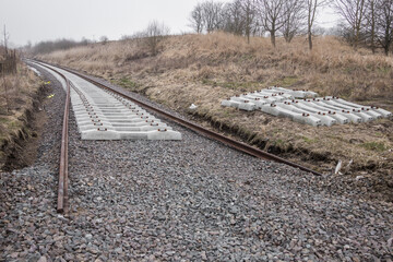 loosely arranged elements of a newly built railway line