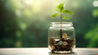 © BB_Stock - Plant in a clear jar filled with coins Saving income Returns from investing money from stocks or funds