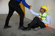 © offsuperphoto - boss hands helping coworker to get up after a break in the factory