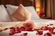 Rose on the bed in the hotel rooms. Rose and her petals on the bed for a romantic evening, red rose and candle