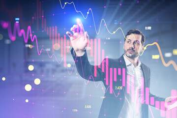 Sticker - Attractive young european businessman using falling candlestick forex chart and index on blurry office interior background. Crisis and finance concept. Double exposure.