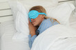 © Atlas - A young woman sleeps in a sleep mask