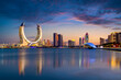 © hasan - Lusail, Qatar - December 26, 2023: Katara buildings view from Lusail Marina Park. Crescent Tower  Fairmont doha