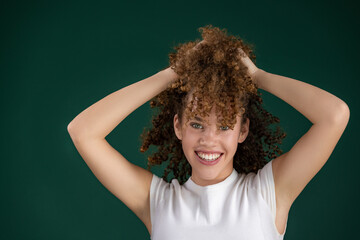 beautiful smiling curly young woman