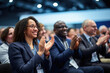 Colleagues Clapping In Conference Event At Convention Center