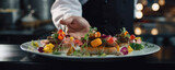 Fototapeta Kuchnia - Chef hands prepares healthy food on wite plate.