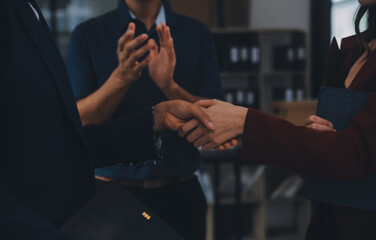 Wall Mural - Business handshake for teamwork of business merger and acquisition,successful negotiate,hand shake,two businessman shake hand with partner to celebration partnership and business deal concept