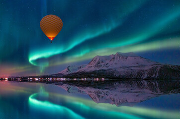 Wall Mural - northern lights or aurora borealis in the sky over tromso, norway