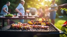 A Photo Of A Family And Friends Having A Picnic Barbeque Grill In The Garden. Having Fun Eating And Enjoying Time. Sunny Day In The Summer. Blur Background
