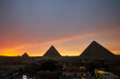 Panoramic view of Giza Pyramids during dramatic sunset
