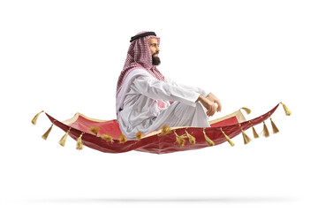 Canvas Print - Arab man sitting on a magic carpet and flying