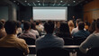 © redflower - Audience in a conference room or seminar meeting showing a presentation video