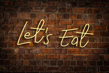 Vibrant Neon Lets Eat Sign