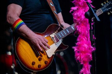 Guitarist performing at a live concert.