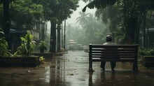 A Photo Took On A Film Kodak Camera Of A Old Guy Sitting Alone In A Bench With His Hands On Head In Kerala On A Rainy Day