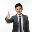 © 일 박 - A man in a suit smiling brightly and giving a thumbs up