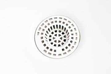 Wall Mural - White ceramic bathroom sink. Plastic white sieve closeup. Empty copy space background. Round shape strainer.