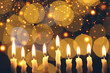 Hanukkah celebration. Burning candles against blurred lights, closeup