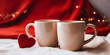 © Olga - Two mugs decorated with hearts on the table, cozy romantic layout