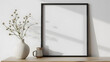 © Prasanth - Empty square frame mockup in modern minimalist interior with plant in trendy vase on white wall background, Template for artwork, painting, photo or poster