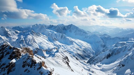 Wall Mural - A panoramic view of a snow-covered mountain range