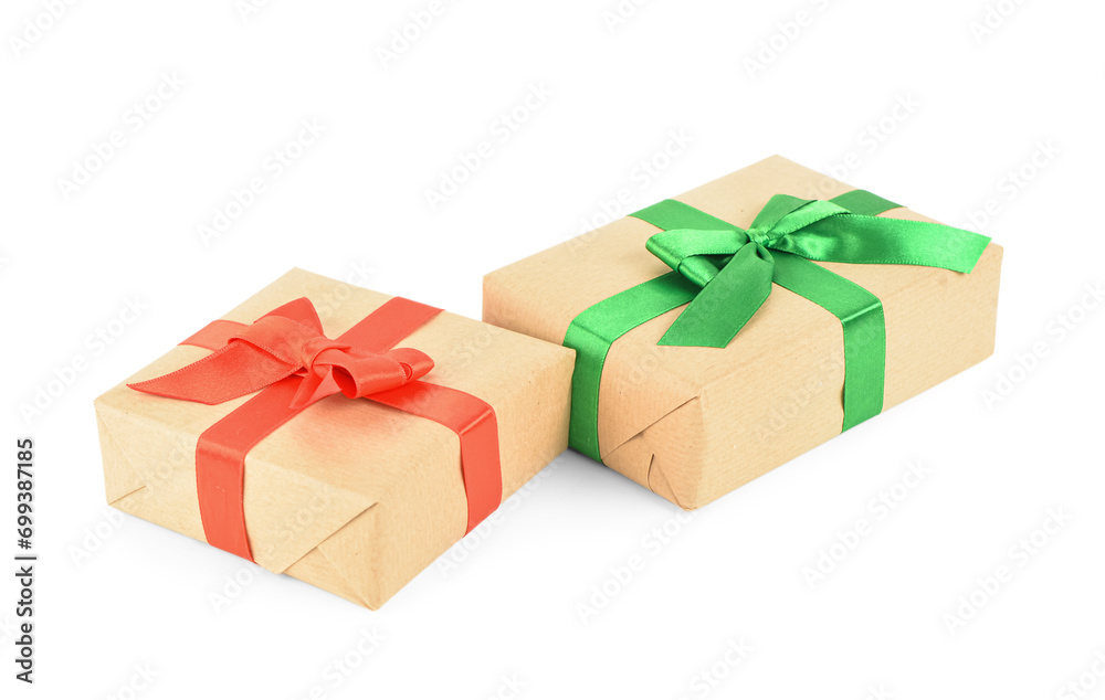 Christmas gift boxes with green and red ribbons on white background