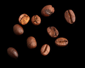 Wall Mural - Coffee beans isolated on black background. Close-up