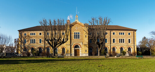 Wall Mural - Facade of visitation convent on a bright winter day,  Roman-Byzantine style, built in 1850, Fourviere hill, Lyon, France