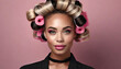 Elegant beauty: gorgeous young woman with curlers in her hair