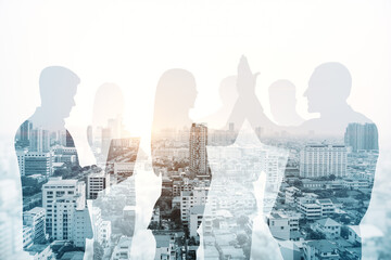 Sticker - Abstract city skyline with businesspeople silhouettes on light wallpaper. Teamwork, partnership and success concept. Toned image. Double exposure.