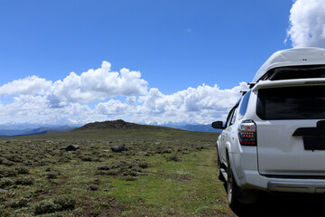 Wall Mural - Off road car on top of high altitude mountain trail, China